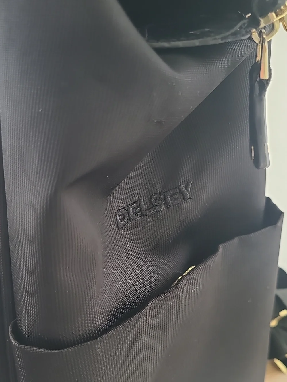 Delsey Paris Black Laptop Backpack with Gold Accent